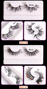 Detailed macro view of Halloween faux mink eyelashes with pumpkin and ghost decorations