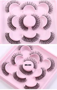 Close-up of 5 pairs of DD curl Russian lashes on pink circular storage tray
