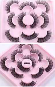 Detailed dual view of dense DD curl Russian strip lashes in a pink petal-shaped tray
