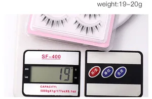 Mesure du poids de faux cils manga à bande transparente sur une balance de 19-20g