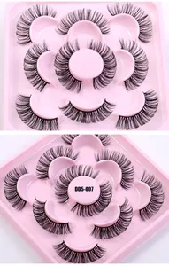 Macro detail of 7 pairs Russian volume D curl false eyelashes on a pink round tray