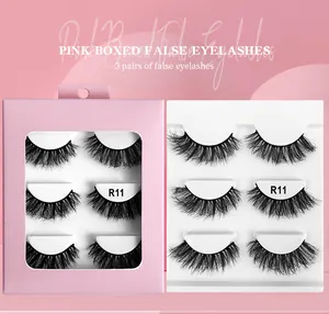 Detail view of R11 6D fluffy faux mink eyelashes in pink packaging with three pairs