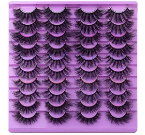 Detailed view of 20 pairs of dense criss-cross eyelashes on a purple tray