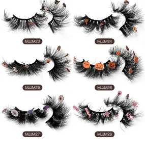 Detailed grid of Halloween false eyelashes with small pumpkin and ghost decorations