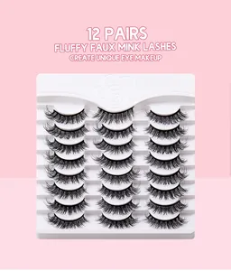 Detailed view of 12 pairs of fluffy, dense false eyelashes on a white display tray
