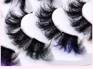 Macro detail of colorful gradient faux mink lashes with natural curl in a white tray