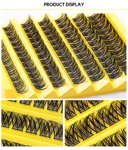 Detailed macro view of 7-row volume cluster lashes on a yellow wave display tray