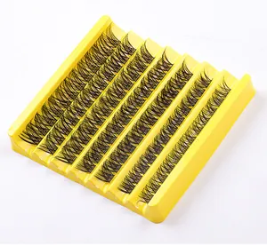 Macro shot of 7 rows segment false eyelashes in a bright yellow tray for DIY lash extension