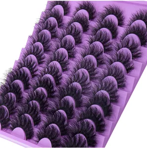 Macro shot of 20 pairs of dense 3D eyelashes on a purple tray with curly fiber texture