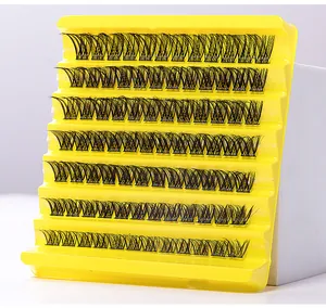 Detailed close-up of 8 rows of dense black cluster eyelashes on a yellow display tray