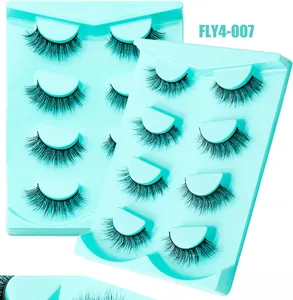 Gros plan des faux cils FLY4-007 épais avec 8 paires sur plateaux bleus
