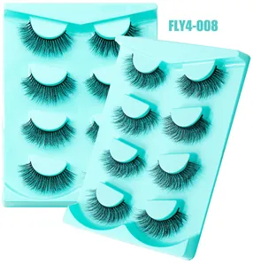 Gros plan de 8 paires de faux cils volumineux croisés avec des bandes noires épaisses