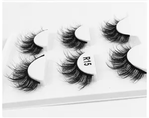 Detail view of 6D fluffy lashes model R15 on white tray showing natural volume