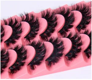 Macro detail of 7 pairs of thick faux mink eyelashes with 3D curl on a pink wavy tray