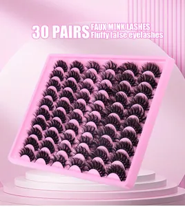 Detailed view of 30 pairs of fluffy faux mink lashes organized on a pink tray