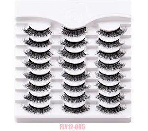 Close-up of 24 pairs of thick curly black false eyelashes in a white tray