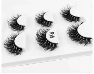 Macro detail of layered 6D fluffy false eyelashes in a set of three pairs for makeup
