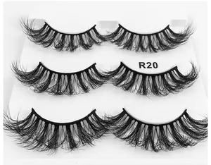 Close-up of three pairs of 6D fluffy mink-style false eyelashes on a white tray