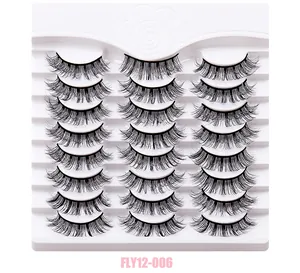Detail view of 21 pairs of black fluffy false eyelashes in a white display tray