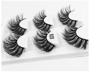 Close-up of R20 3D fluffy false eyelashes with dense black fibers in a white tray