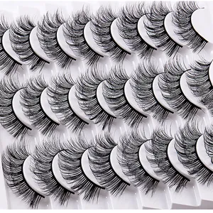 Detailed view of 15 pairs of dense curly false eyelashes arranged in a clean white tray