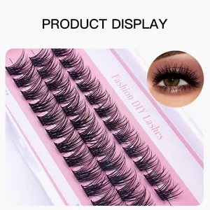 Detail view of segmented DIY eyelash clusters in natural dense style on pink background