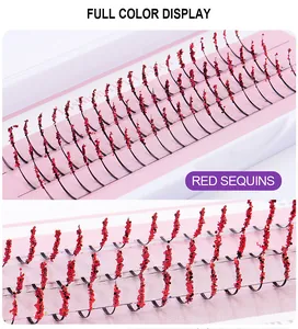 Macro detail of individual black individual eyelashes with shimmering red sequins decoration