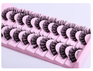 Detail view of 14 pairs of thick black DD-curl false eyelashes on a pink tray DD-027