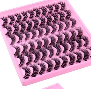 Macro shot of 20 pairs dense curly false eyelashes arranged on a pink plastic tray