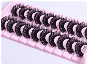 Detailed close-up of dense curly DD-030 false eyelashes in pink tray set