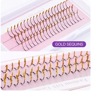 Detail of DIY individual cluster lashes with glittery gold sequins and pink packaging
