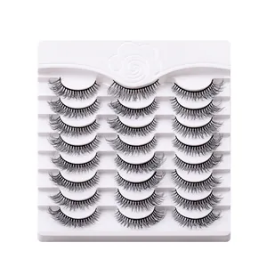 Set of 12 pairs natural dense voluminous false eyelashes on white display tray