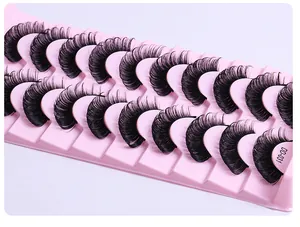 Macro shot of 10 pairs of dense black DD curl Russian lashes on pink tray, model DD-031