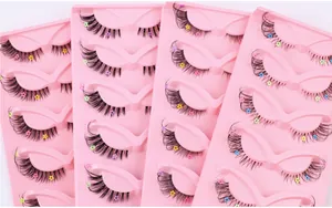 Detail of fox-eye false eyelashes with colorful mini flower sequins and clear band