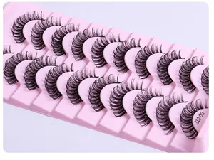 Macro shot of 10 pairs of Russian DD-curl dense false eyelashes in a pink tray