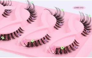 Detailed view of 5 pairs of black fox-style eyelashes with colorful flower sequins