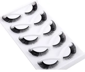 Detailed view of 5 pairs of thick black cat-eye false eyelashes on white tray