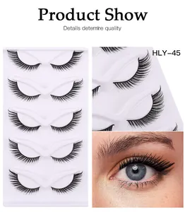 Detailed view of 5 pairs of natural dense false eyelashes on a white tray with eye effect