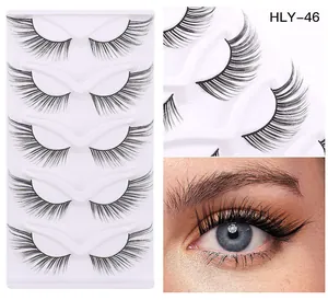 Detailed view of HLY-46 false eyelashes with 5 pairs in tray and worn on the eye