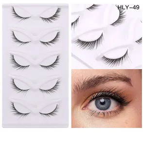 Detailed view of 5 pairs of natural thick eyelashes on a tray with eye application model