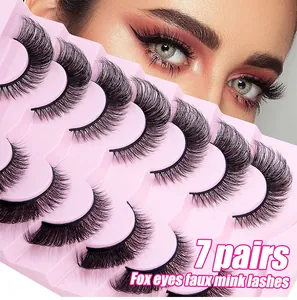 Detail of 7 pairs of fox eye faux mink lashes showing thick texture and winged effect