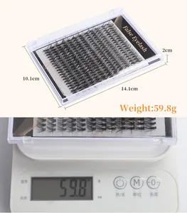 Detailed view of false eyelash packaging dimensions 14.1x10.1x2cm and 59.8g weight on scale