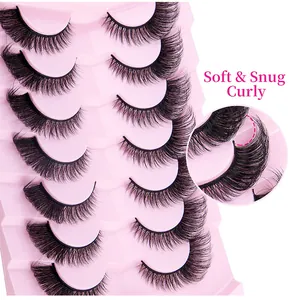 Macro detail of 7 pairs of fox-eye false eyelashes showing soft curly hair texture