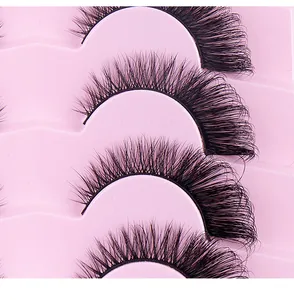 Macro detail of 7 pairs of black fox-eye false eyelashes with a curled fiber texture