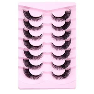 7 pairs of curled fox-eye false eyelashes on pink tray for thick natural makeup look