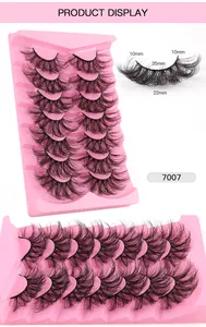Macro shot of 7 pairs of layered 3D faux mink lashes in 10-22mm lengths for stage makeup