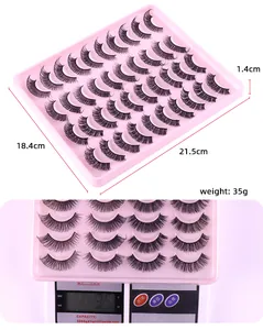 Detailed view of 30 pairs of black D-curl false eyelashes in a pink 21.5cm x 18.4cm tray
