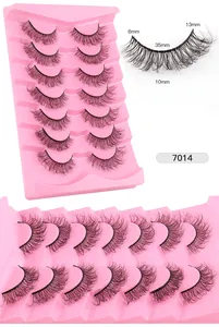 7 pairs of messy faux mink lashes with 6-13mm length specifications on pink tray