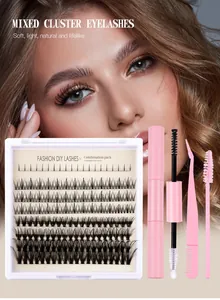 Macro detail of DIY eyelash extensions kit with pink tweezers and lash brushes