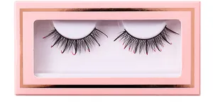 Close-up of black false eyelashes with red glitter tips in a pink rose gold window box